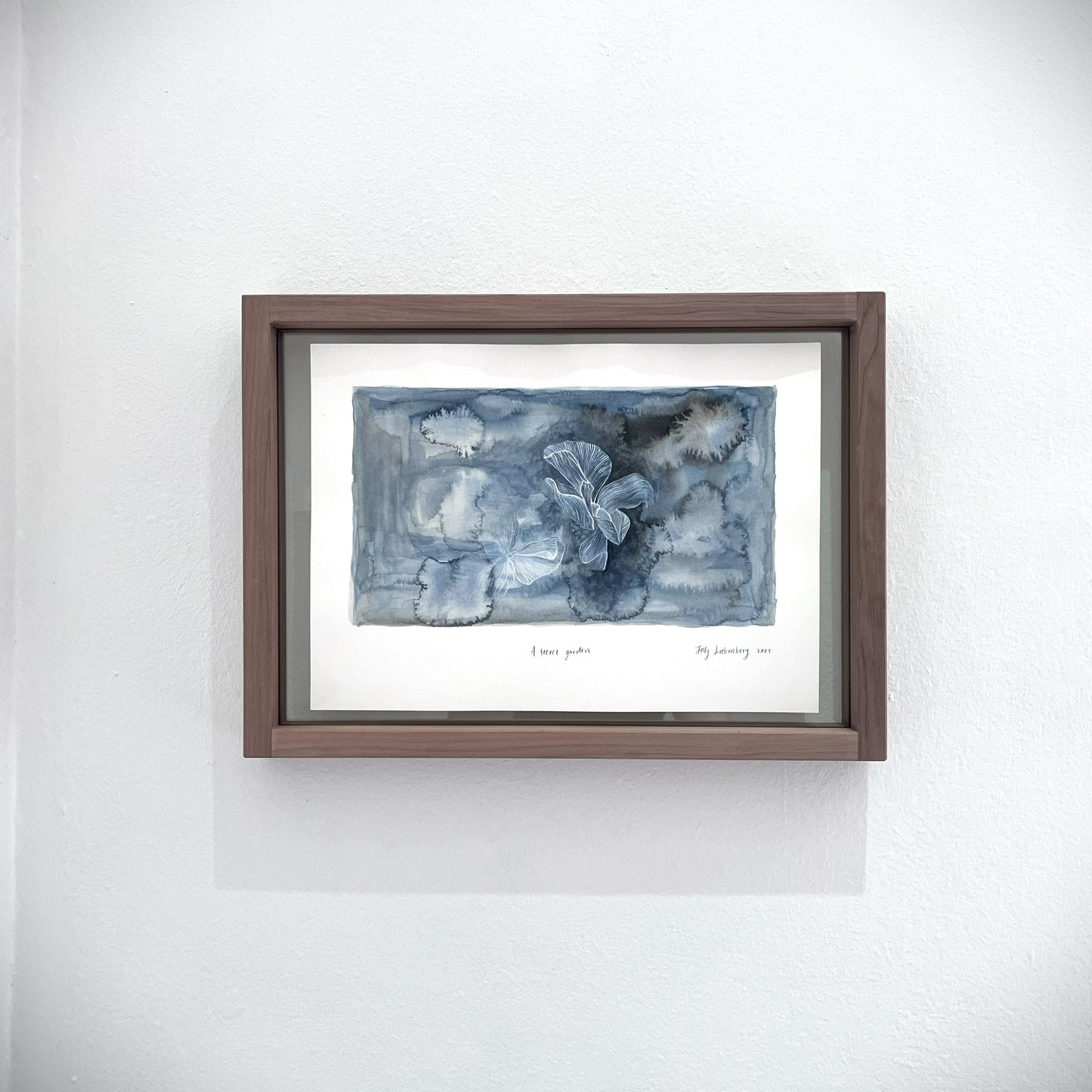 Front view of framed painting, A secret garden.