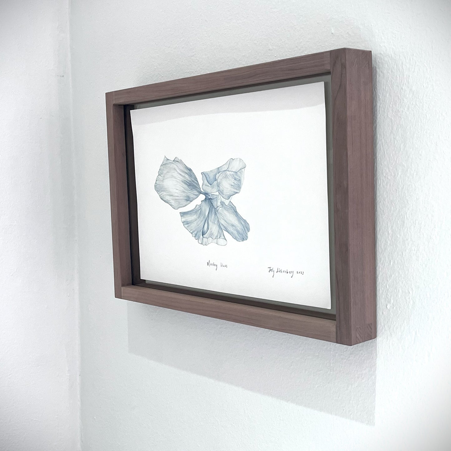 Side view of framed painting, Monday blues.